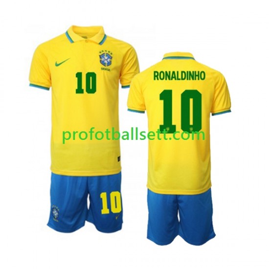Fotballdrakt Brasil Ronaldinho 10 Barn Hjemmekit VM 2022 Kortermet